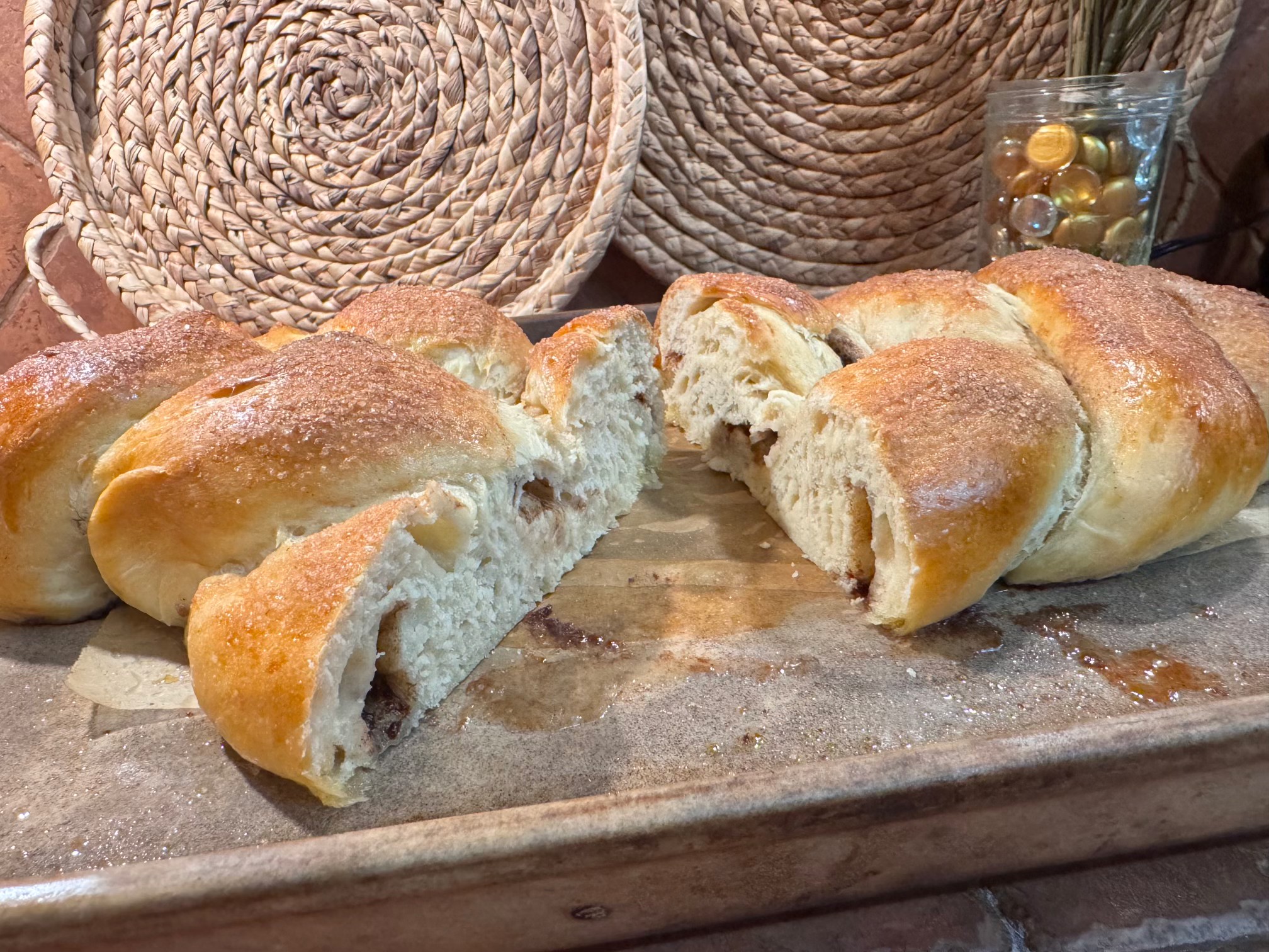 Cinnamon swirl pull-apart bread torn open on a sheet pan